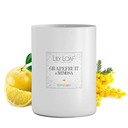 Grapefruit and Mimosa Soy Wax Candle with ingredients behind