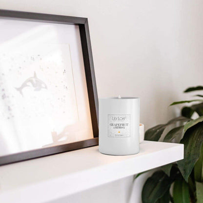 Lily & Loaf Grapefruit and Mimosa Soy Wax Candle on a living room mantlepiece 